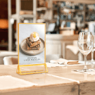 A gold table sign holder looks great in restaurants, cafes, and at events