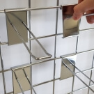 Use your grid wall with hooks and accessories for a versatile mesh display