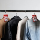 Use a sale tag on clothes hangers or apply with a tagging gun