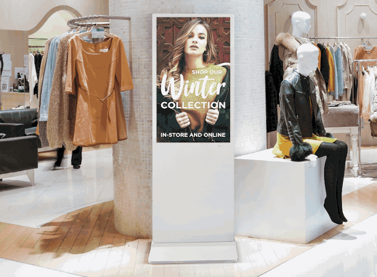 digital display totem advertising a winter clothes collection